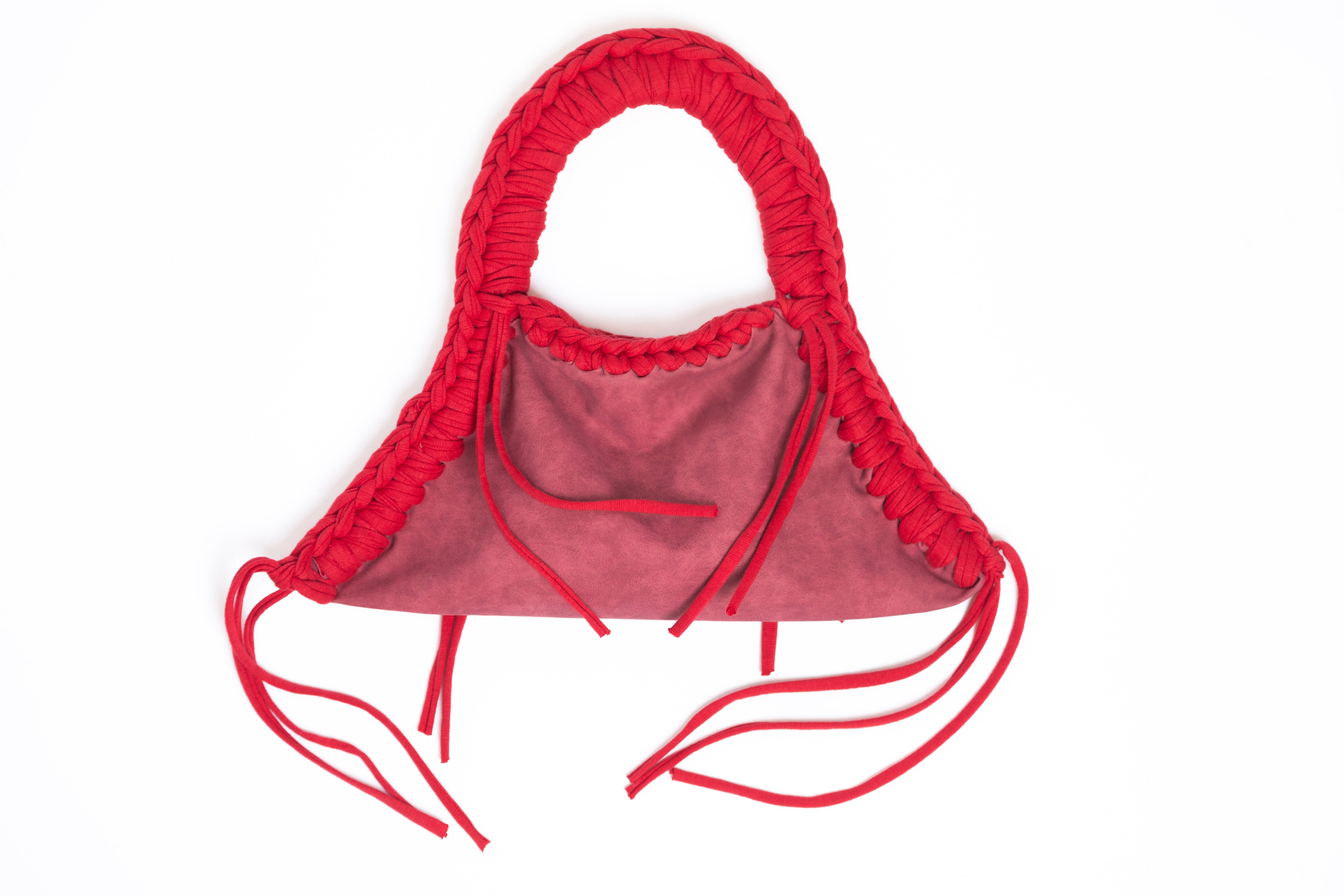 Red bikini top with ruffled details on a white background