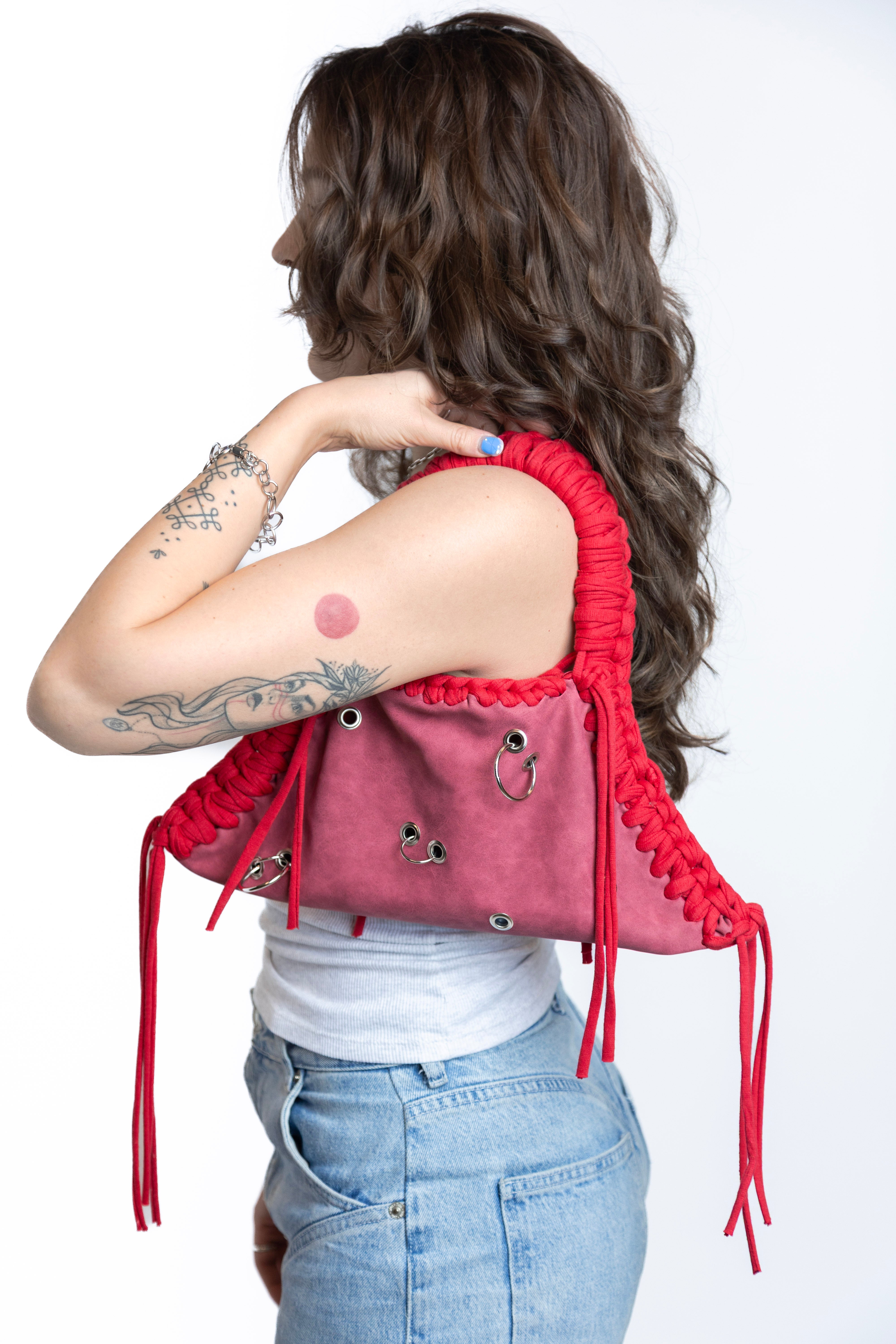 Woman wearing a red backpack with a white background